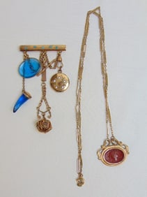 Jewelry. Antique gold filled chatelaine style brooch, pin w/ blue glass intaglio, horn, locket,