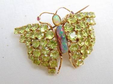 Jewelry. Opal Peridot 10kt butterfly pin w/ ruby eyes, 20.35 grams