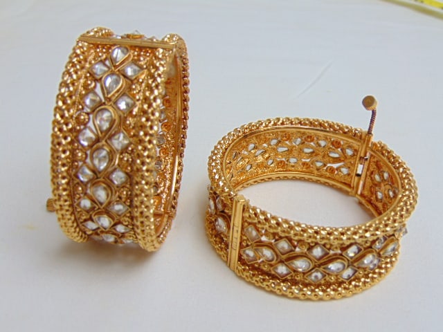 Jewelry. (2) Indian gold filled hinged bangles w/ filigree design, faceted clear stones, screw hinge (1 of 3)