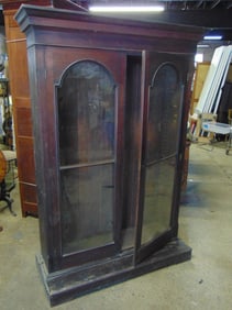 Mahogany double door bookcase, glass in doors is loose, cabinet is 48" wide, 20" deep, height is 78.