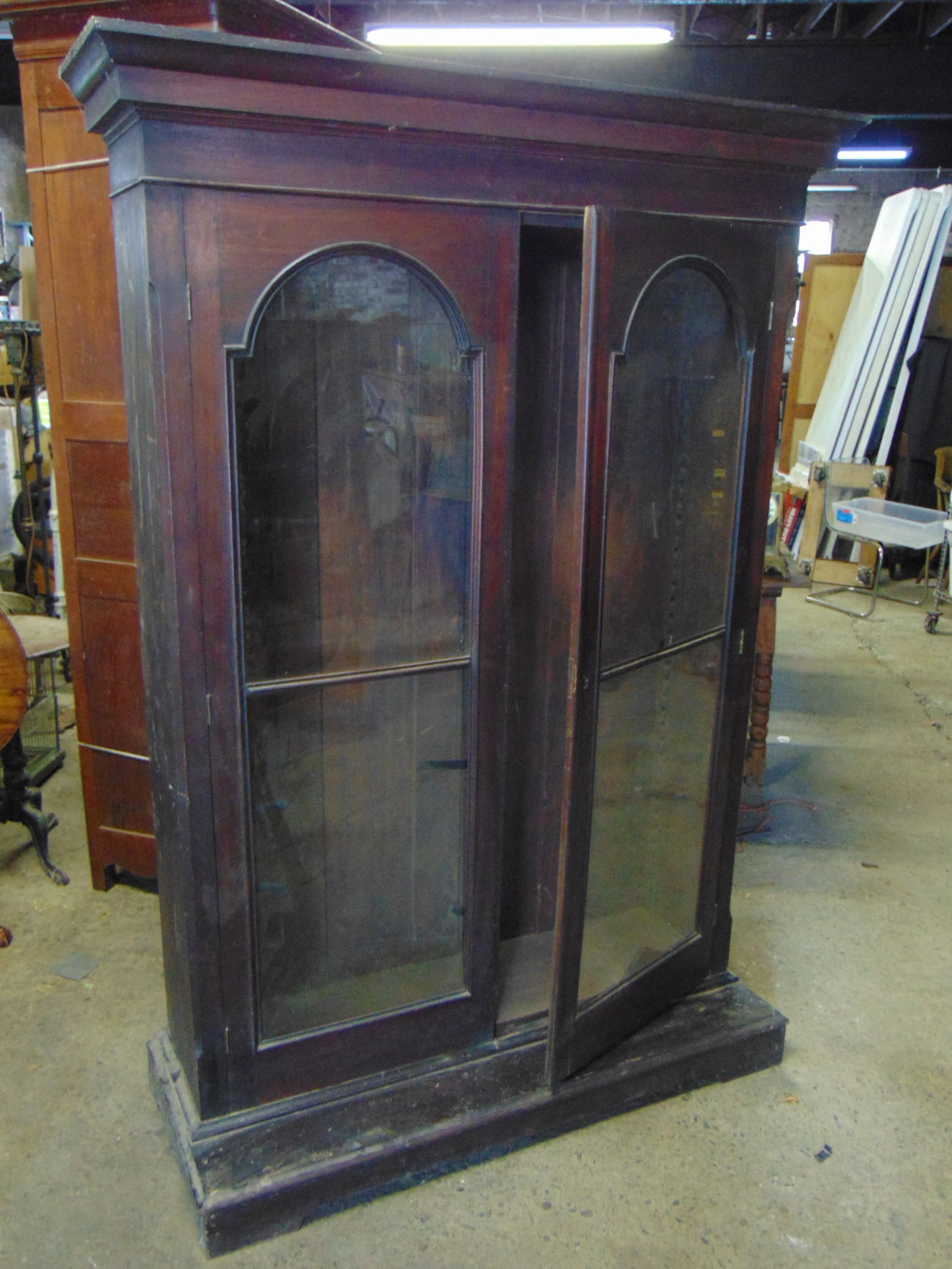 Mahogany double door bookcase, glass in doors is loose, cabinet is 48" wide, 20" deep, height is 78. (1 of 4)