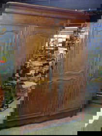 Large double door French armoire, carved detail, no shelves, cabinet is 63.5" wide, 25" deep, height