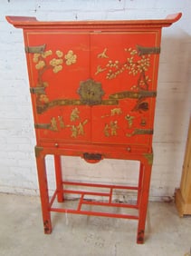 Chinese cabinet on base in red lacquer, cabinet is 31" by 17", height is 63"