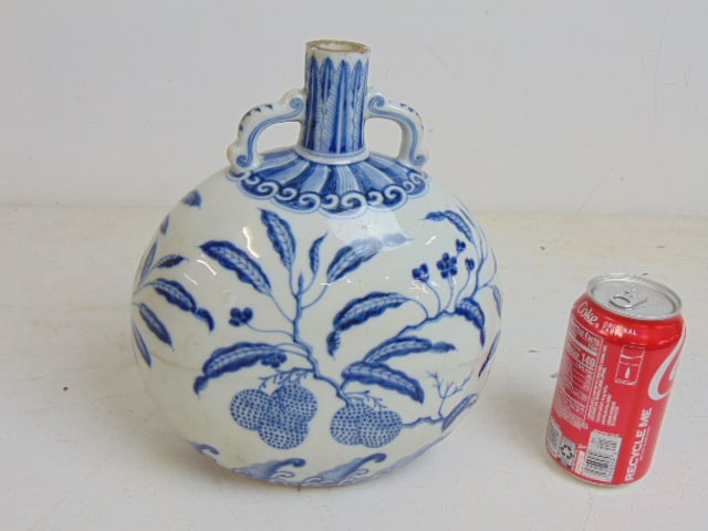 Blue & white porcelain vase with handles decorated with branches & fruit, drilled, neck is cut down,: Blue & white porcelain vase with handles decorated with branches & fruit, drilled, neck is cut down, height is 10", 8.5" wide.