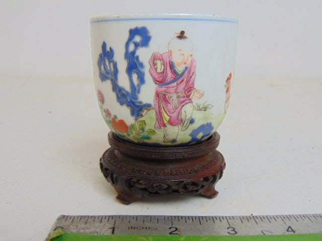 Small Chinese porcelain cup with calligraphy, signed on base, on small wood base, 3" in diameter,: Small Chinese porcelain cup with calligraphy, signed on base, on small wood base, 3" in diameter, height is 2 5/8"