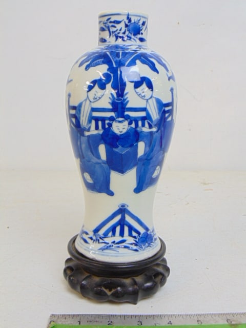 Blue & white Chinese porcelain vase with figures, children playing, on wood base, vase is 8 7/8": Blue & white Chinese porcelain vase with figures, children playing, on wood base, vase is 8 7/8" tall, drilled.