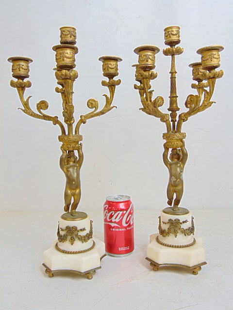 Pair French style bronze cherub base candelabra on white marble bases, 18" tall: Pair French style bronze cherub base candelabra on white marble bases, 18" tall