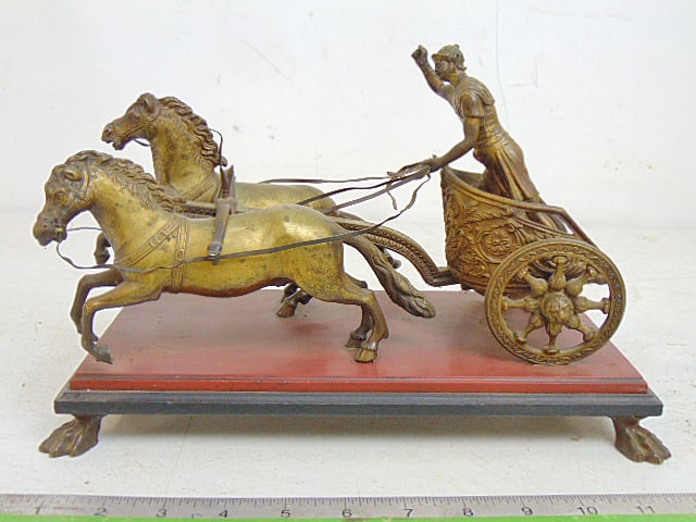 Bronze, Roman riding two horse chariot, on red & black slate base, claw feet, 12" by 6.75", height: Bronze, Roman riding two horse chariot, on red & black slate base, claw feet, 12" by 6.75", height is 7.75"