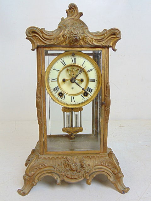 French style crystal regulator with faux mercury glass weight, Ansonia, clock is 8.75" by 7.5",: French style crystal regulator with faux mercury glass weight, Ansonia, clock is 8.75" by 7.5", height is 15.25 small chip in glass side panel, with key.