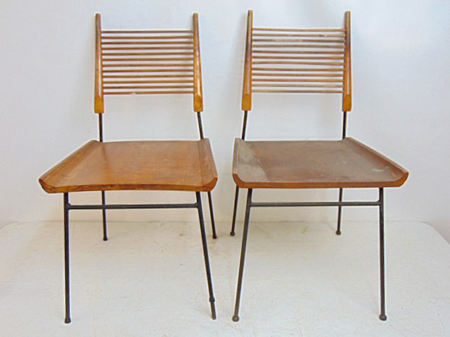 Pair Paul McCobb "Shovel" chairs, wood seat, iron base, horizontal spindle back, seat is 18.5" by: Pair Paul McCobb "Shovel" chairs, wood seat, iron base, horizontal spindle back, seat is 18.5" by 16.785" (seat), height is 33.75"