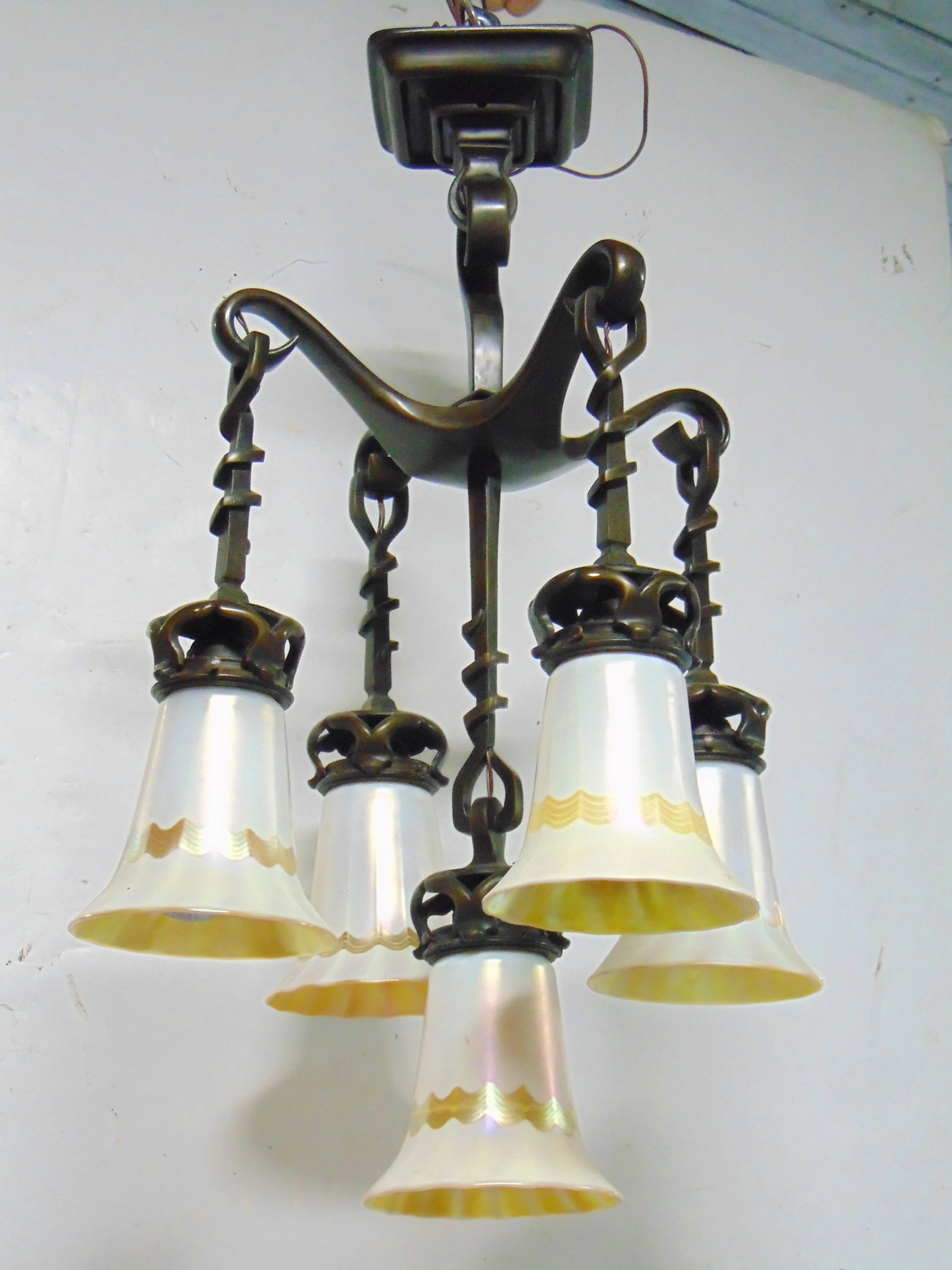 Period bronze hanging fixture with 5 Quezal art glass shades, shades in white with decoration, good: Period bronze hanging fixture with 5 Quezal art glass shades, shades in white with decoration, good condition fixture 25" tall as shown, diameter is 16" shades in good condition
