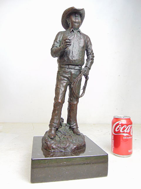Bronze figure, "Charlie", by Joe Beeler, rancher with whip & cigarette, signed illegibly, edition: Bronze figure, "Charlie", by Joe Beeler, rancher with whip & cigarette, signed illegibly, edition 74/100, on marble base, height is 17.5"