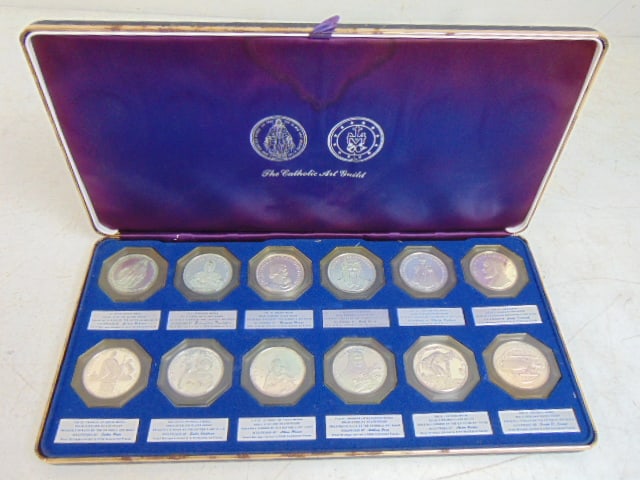 Set of 12 silver coins by the Catholic Art Guild, in original presentation case, 10 troy.: Set of 12 silver coins by the Catholic Art Guild, in original presentation case, 10 troy.