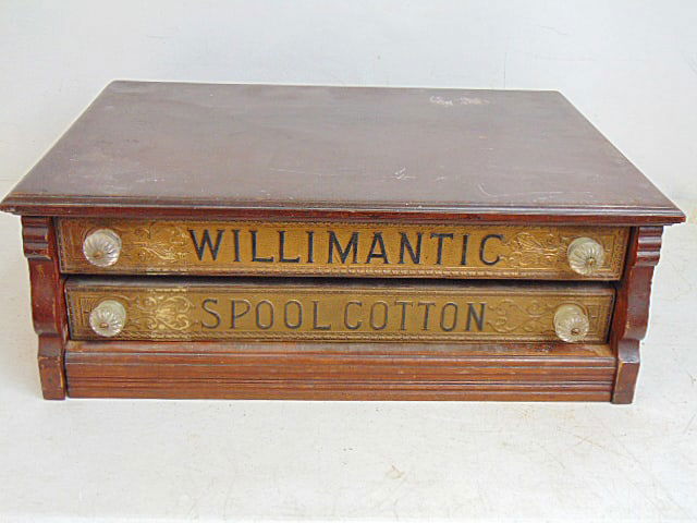 Two drawer spool cabinet, "Willimantic, Spool Cotton" The Best Thread Sewing Machines", drawers have: Two drawer spool cabinet, "Willimantic, Spool Cotton" The Best Thread Sewing Machines", drawers have glass knobs, 23.5" by 16.5", height is 8.5"