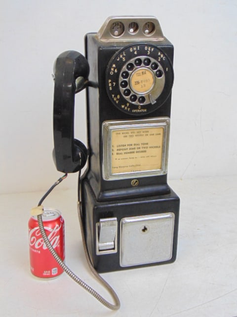 Vintage wall phone, coin operated, phone is 18" tall, 5.75" deep.: Vintage wall phone, coin operated, phone is 18" tall, 5.75" deep.