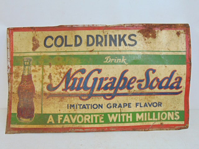 Litho tin advertising sign, "Cold Drinks, drink NuGrape-Soda, Imitation Grape Flavor", sign is 42": Litho tin advertising sign, "Cold Drinks, drink NuGrape-Soda, Imitation Grape Flavor", sign is 42" by 24.5", has rust, dents, as found.