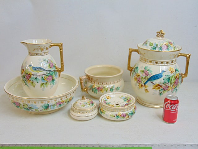Large English porcelain dresser, vanity set, wash & bowl, potty, shaving dish, soap dish & large jar: Large English porcelain dresser, vanity set, wash & bowl, potty, shaving dish, soap dish & large jar with lid, decorated with flowers & birds, the large bowl in cracked.