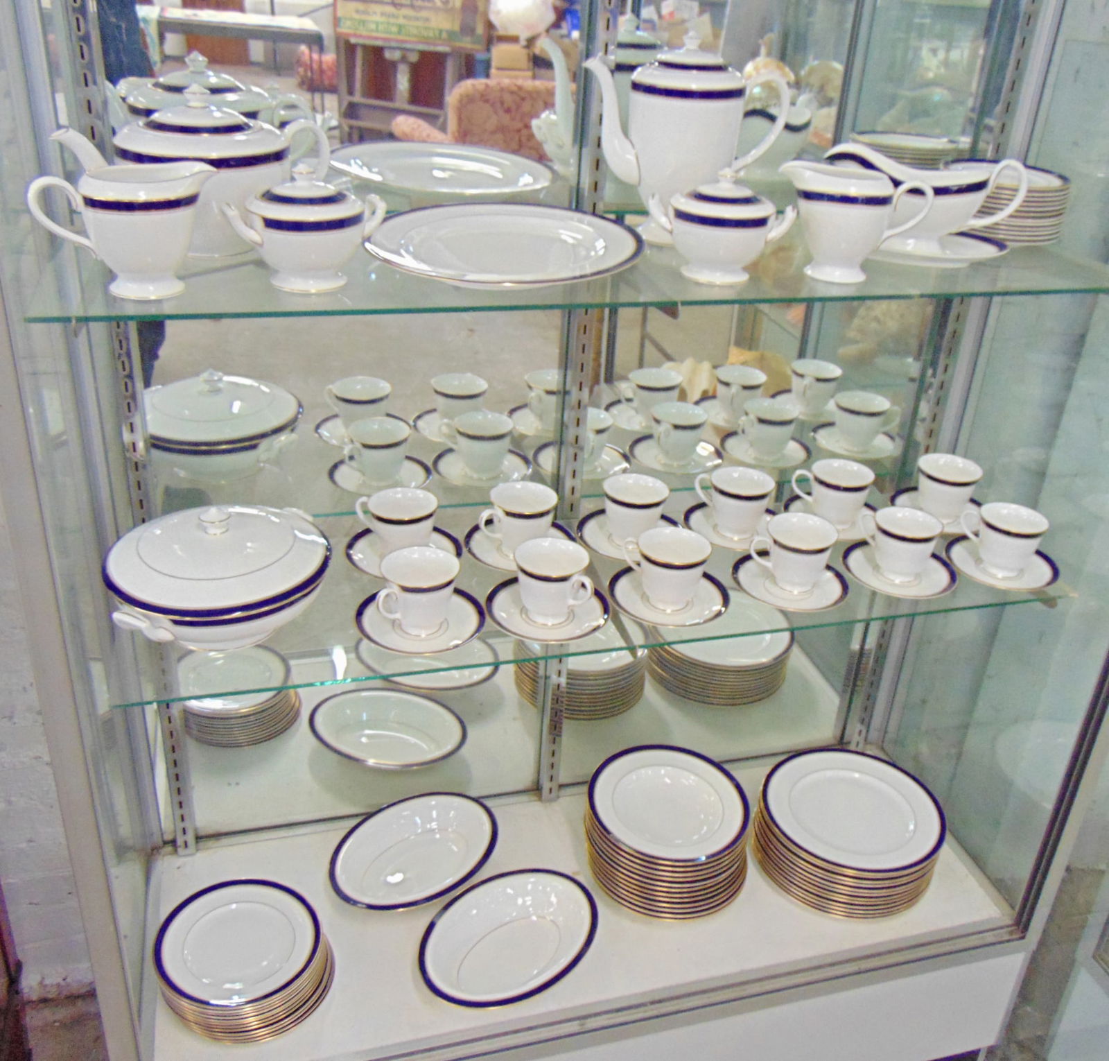 Set of Royal Worcester "Howard" dinnerware, white with blue trim, service for 12 plus 2 bowls,: Set of Royal Worcester "Howard" dinnerware, white with blue trim, service for 12 plus 2 bowls, covered bowl, 3 piece tea & coffee set, gravy boat, serving platter, in excellent condition