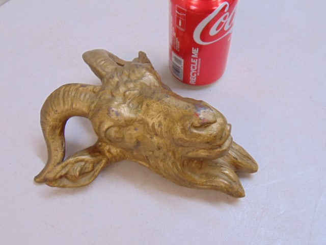 Cast iron goat's head in gold paint, 8" tall, 7" wide: Cast iron goat's head in gold paint, 8" tall, 7" wide