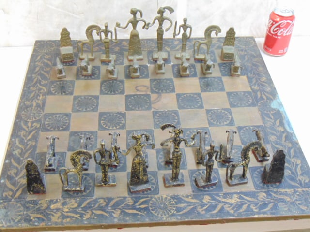 Bronze chess set "Minoan" themed by Greek sculptor Christoforus Sklavenitis, complete, board is 23.7: Bronze chess set "Minoan" themed by Greek sculptor Christoforus Sklavenitis, complete, board is 23.75" by 23.75"