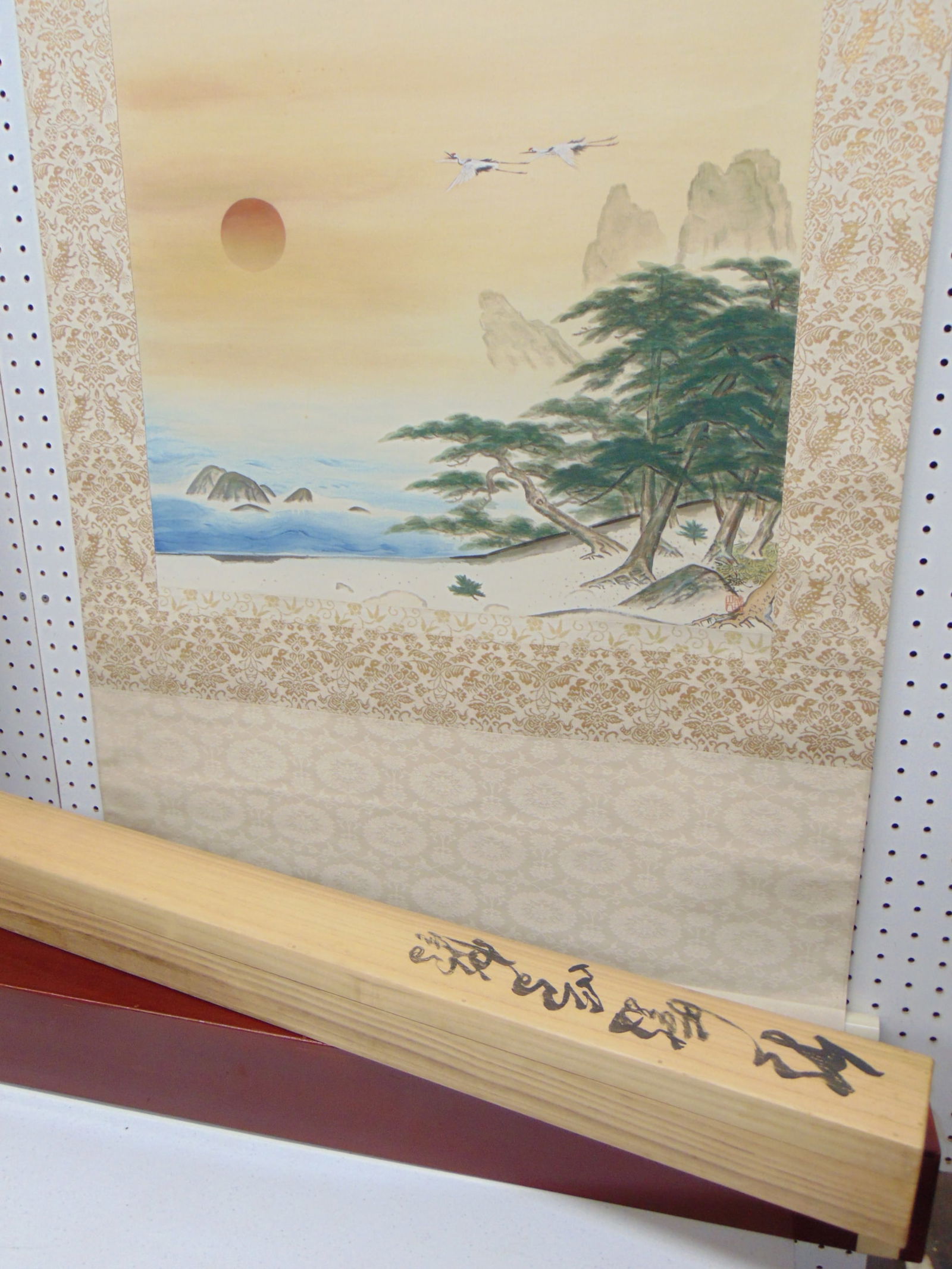 Japanese scroll in original case, flying cranes, scroll is 62" by 29.5", writing on box.