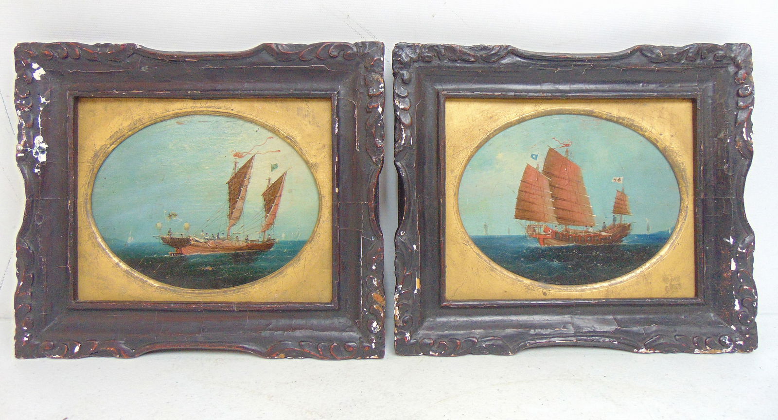 Two China trade paintings, Chinese Junk ships at sea, one with full sails, unsigned, oil on board,: Two China trade paintings, Chinese Junk ships at sea, one with full sails, unsigned, oil on board, 5" by 6.5" sight (oval), framed size is 8.75" by 10.25"
