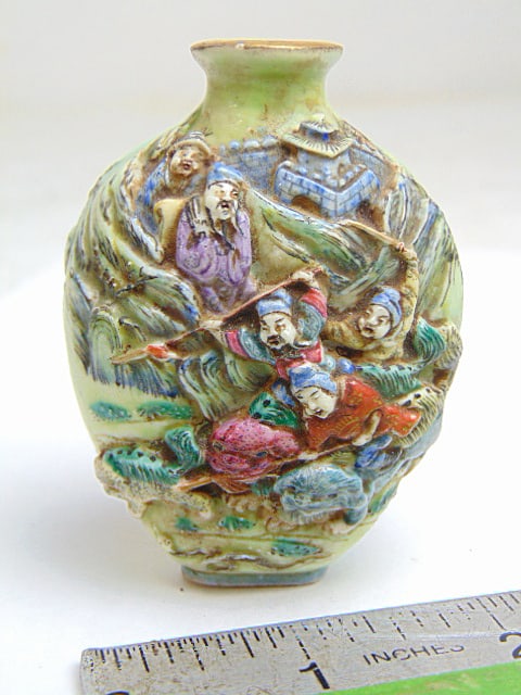 Chinese porcelain snuff bottle decorated with battle scenes, no spoon, no lid, signed, 3" tall, 2: Chinese porcelain snuff bottle decorated with battle scenes, no spoon, no lid, signed, 3" tall, 2 1/8" wide.