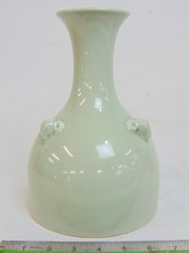 Chinese Celadon vase, decorated with rams heads, drilled, vase is 9.75" tall, diameter is 6.75"