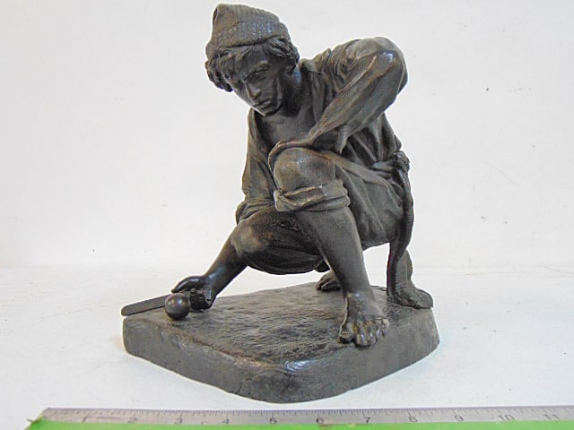 Bronze, man with tool & ball, unsigned, crouched figure with wool cap, textured patinated base,: Bronze, man with tool & ball, unsigned, crouched figure with wool cap, textured patinated base, excellent quality, base is 10" deep, 7.75" wide, height is 11.5"