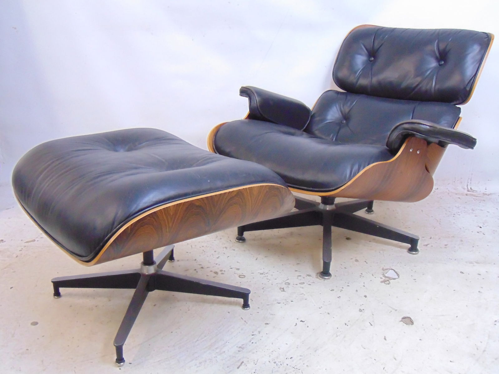 Charles Eames for Herman Miller rosewood chair & ottoman, black leather, in gently used condition,: Charles Eames for Herman Miller rosewood chair & ottoman, black leather, in gently used condition, leather good.