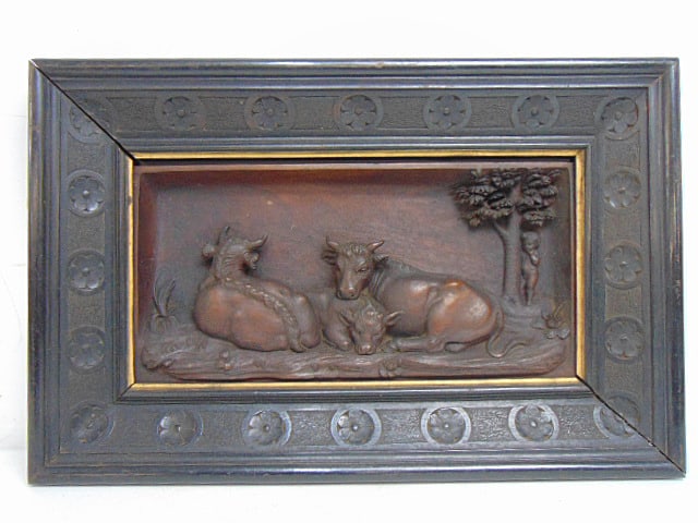 Carved wood plaque, cows under tree with small boy looking on, in ebonized frame, unsigned, 12" by: Carved wood plaque, cows under tree with small boy looking on, in ebonized frame, unsigned, 12" by 18.5"