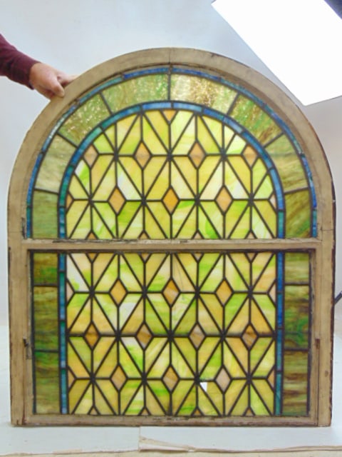 Leaded glass window, domed top, diamond pattern, window is 43.35" by 37.25", several small panels: Leaded glass window, domed top, diamond pattern, window is 43.35" by 37.25", several small panels are cracked, one has loss.