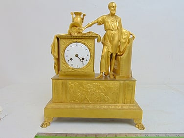 Antique gilt bronze Empire mantle clock, classical decoration with figure and urns, one on it's side