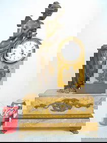 Bronze & marble figural clock, winged lady leaning on domed top marble clock, applied bronze