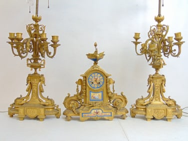 Bronze & porcelain clock set, with candelabra, as found, clock is missing part of finial, several