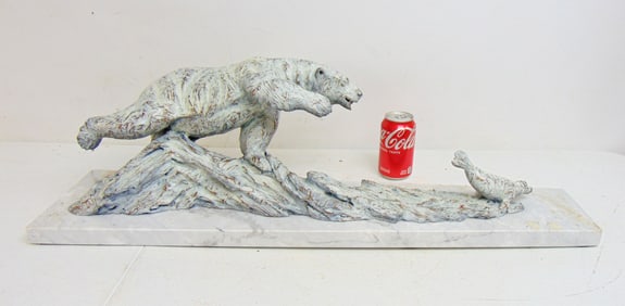 Bronze, polar bear chasing seal, by Ott Jones, on white marble base, bronze has white patina, 33.5"