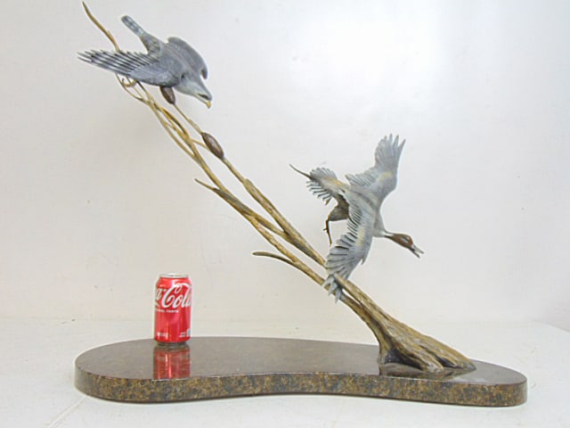 Bronze hawk chasing duck, signed Ott Jones, cold painted, on polished granite base, base is 27.25": Bronze hawk chasing duck, signed Ott Jones, cold painted, on polished granite base, base is 27.25" by 11" (approx.), height is 25.25"