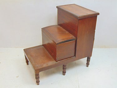 English mahogany leather top library steps, top step has lift top compartment, center slides out,