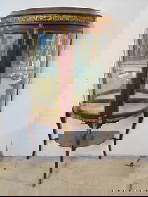 French curved front curio cabinet with glass shelf bronze trim and lower shelf, cabinet is 29" wide,