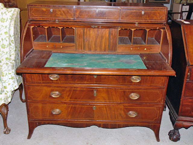 Mahogany inlaid cylinder desk, early 19th century Hepplewhite style, triple drawer base, fitted desk: Mahogany inlaid cylinder desk, early 19th century Hepplewhite style, triple drawer base, fitted desk interior with 3 upper drawers, 48.25" wide, 24.75" deep, height is 47.25"