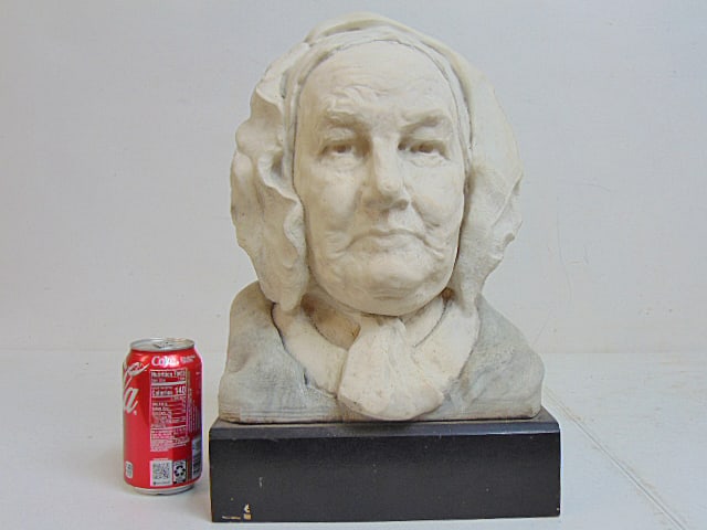 Carved marble bust, Chester Beach, bust of the artists grandmother, on black wood base, base is: Carved marble bust, Chester Beach, bust of the artists grandmother, on black wood base, base is 10.25" wide, 9" deep, height is 16" ex Stait Gallery