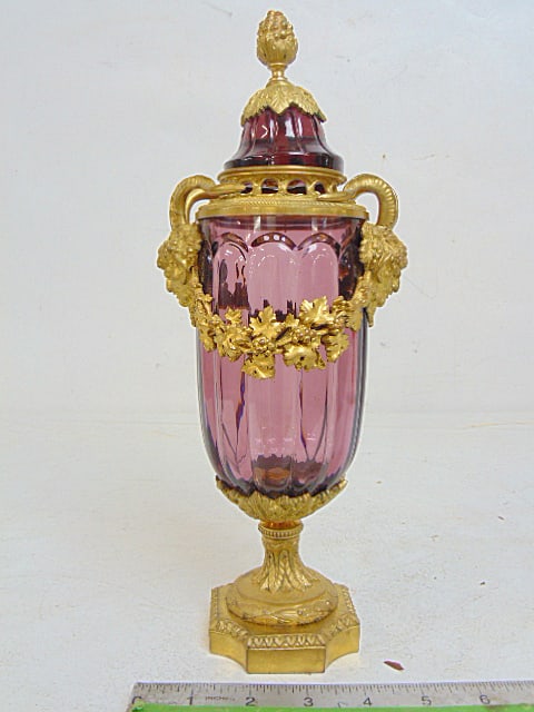 Bronze & amethyst glass lidded jar, fine quality gilt bronze demon head sides, base, height is 12: Bronze & amethyst glass lidded jar, fine quality gilt bronze demon head sides, base, height is 12 38", opening is slightly bent, small flea bite on lid, otherwise ok.