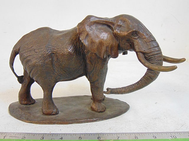 Bronze elephant, signed Mathews, 10" long, 6" wide, 6.75" tall.: Bronze elephant, signed Mathews, 10" long, 6" wide, 6.75" tall.