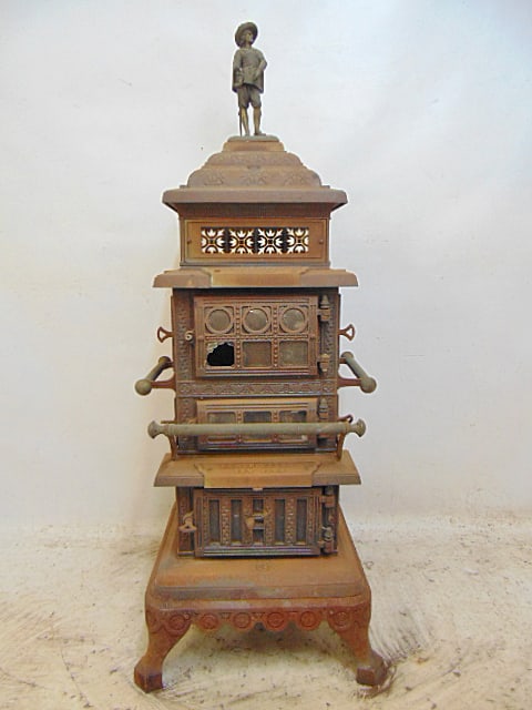 Cast iron stove, "Franklin Square", top inlaid with tiles, by Sam S. Utter, New York, # 13, possibly: Cast iron stove, "Franklin Square", top inlaid with tiles, by Sam S. Utter, New York, # 13, possibly made for the Columbia Exhibition, figure on top stove has small crack in arm (see images), stove is