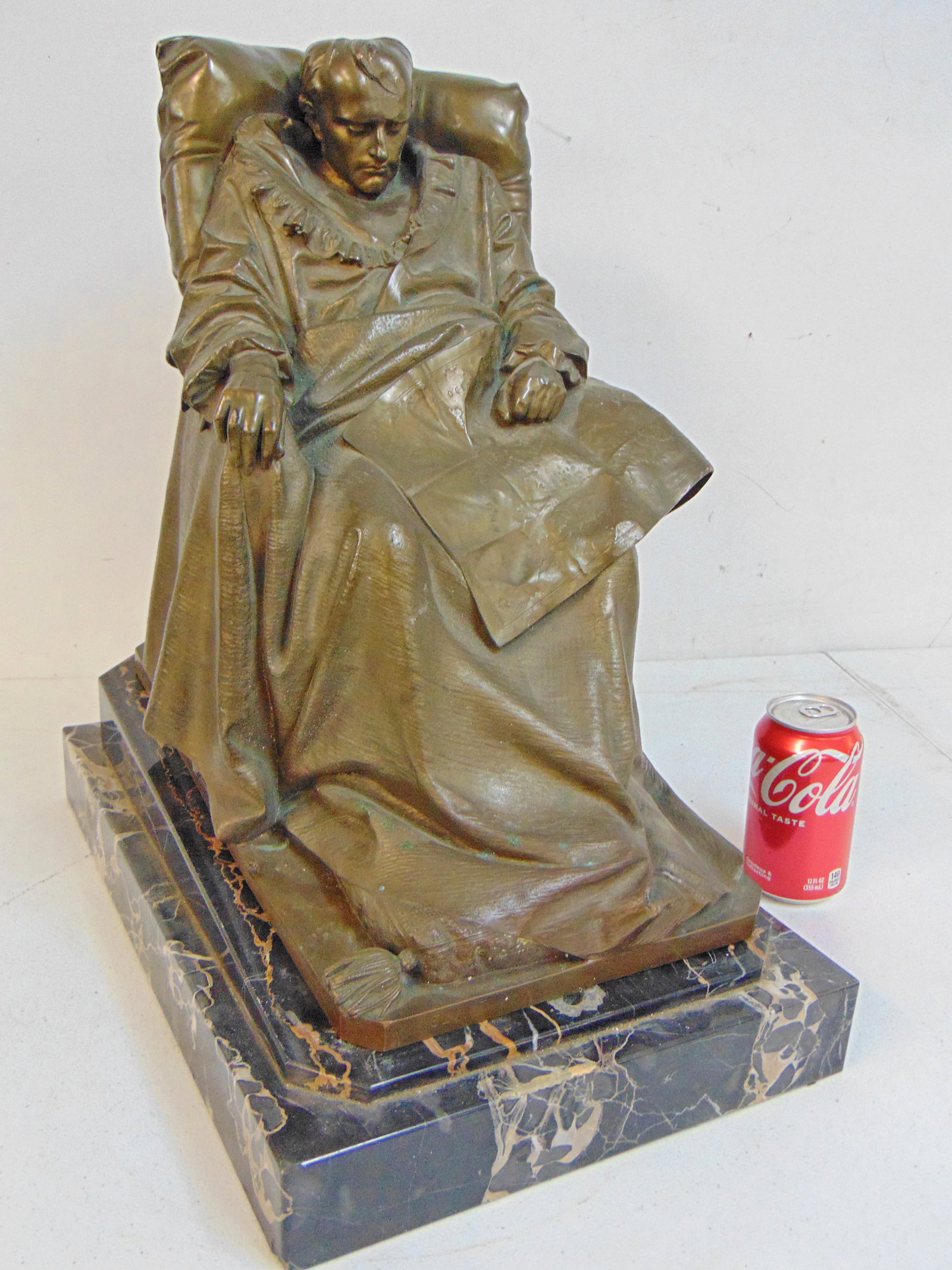 Bronze, "The Last Days of Napoleon" after Vincento Vela, on black marble base, Barbedienne Foundry,: Bronze, "The Last Days of Napoleon" after Vincento Vela, on black marble base, Barbedienne Foundry, base is 17.75" by 11 7/8", height is 19.5", small dent in head, chips around holes in marble base.