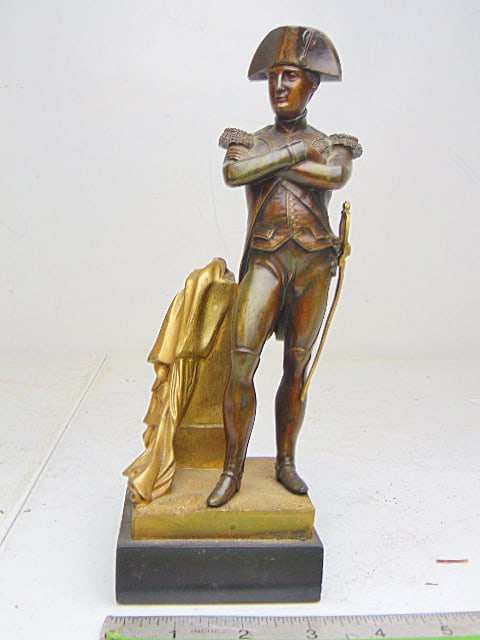 Bronze figure Napoleon Bonaparte, mixed patina, showing Napoleon standing, arms crossed with sword: Bronze figure Napoleon Bonaparte, mixed patina, showing Napoleon standing, arms crossed with sword on his side, height is 9.5", base is 3.25" by 3.25"
