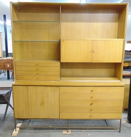 Paul McCobb wall cabinet, top section with drawers, glass shelves & cabinet, brass legs, missing two