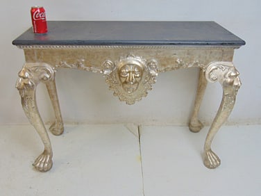 Silver gilt console table with carved lion figure in skirt, rope edge, top in grey paint, claw feet,