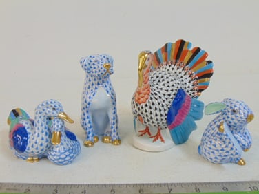 4 Herend figurines with fishnet decoration, three in blue, one in black, blue dog, blue bunny, blue
