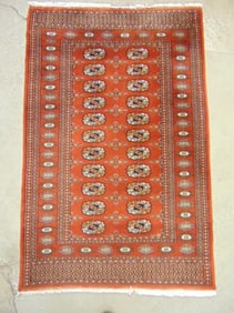 Bokhara scatter rug in brown, carpet is 60" by 39"